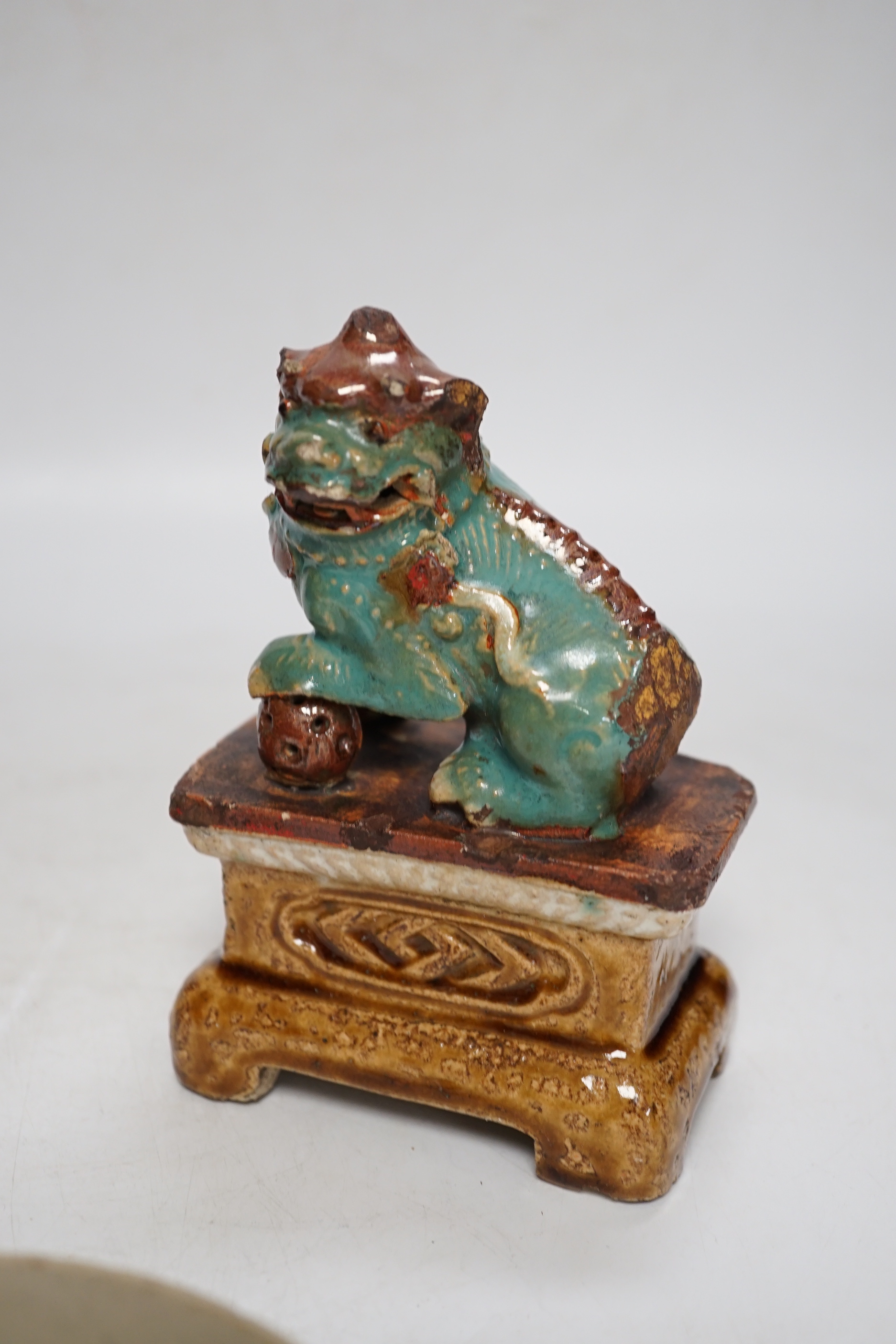 A 19th century Chinese Shiwan figure of a lion-dog, a celadon glazed shallow bowl and a cloisonné enamel censer, tallest 14cm (3)